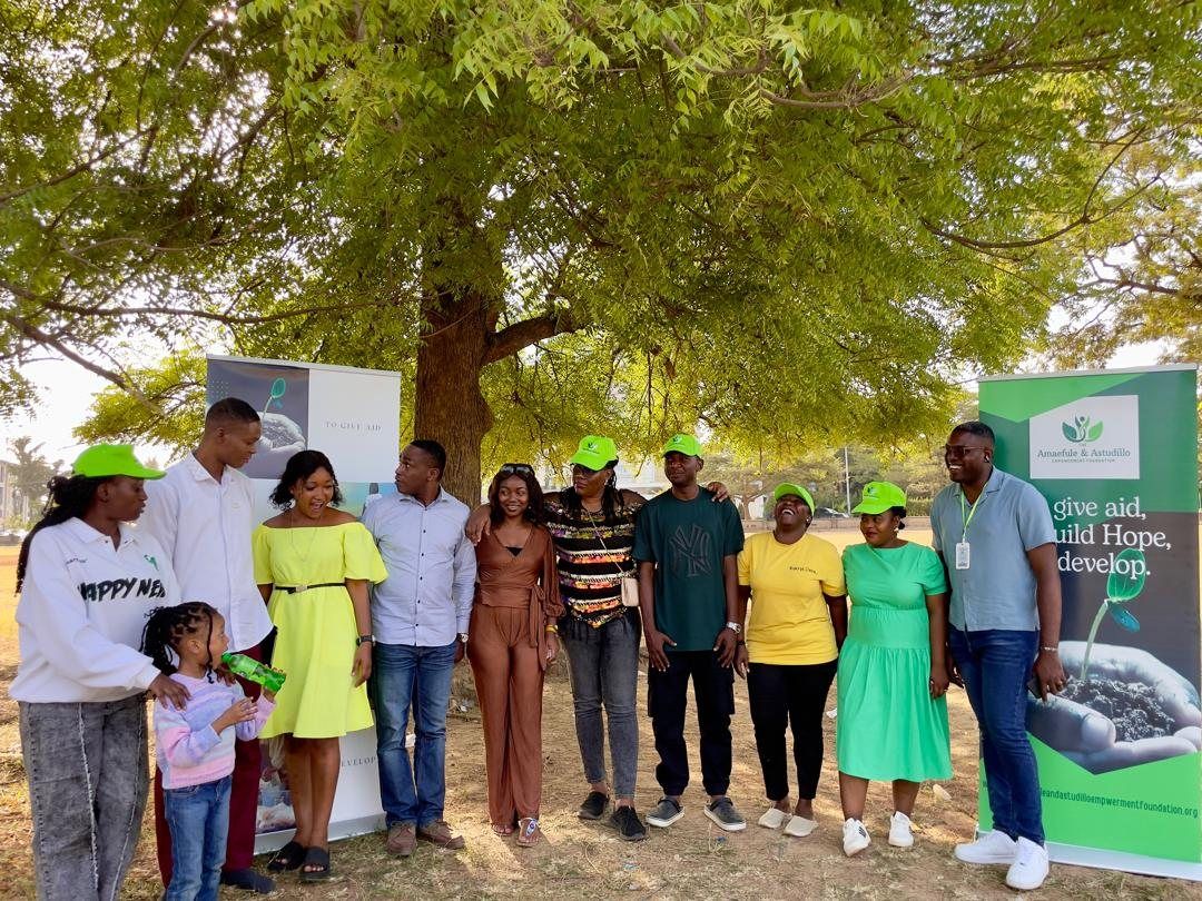 The volunteer team under the trees.